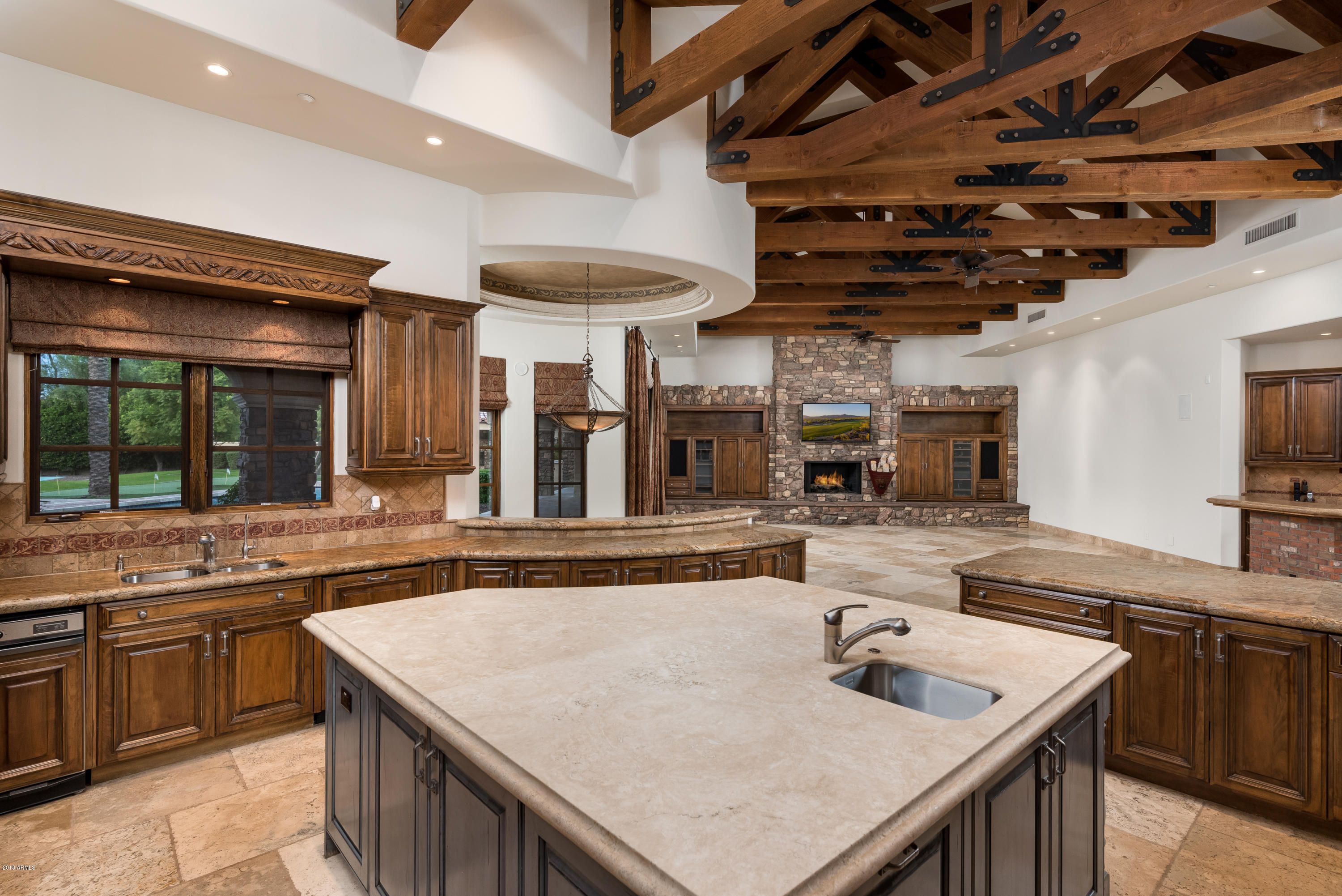 6390 East Royal Palm Road Paradise Valley, AZ 85253 - Photo 16 of 58 a kitchen with a stove a sink and a refrigerator
