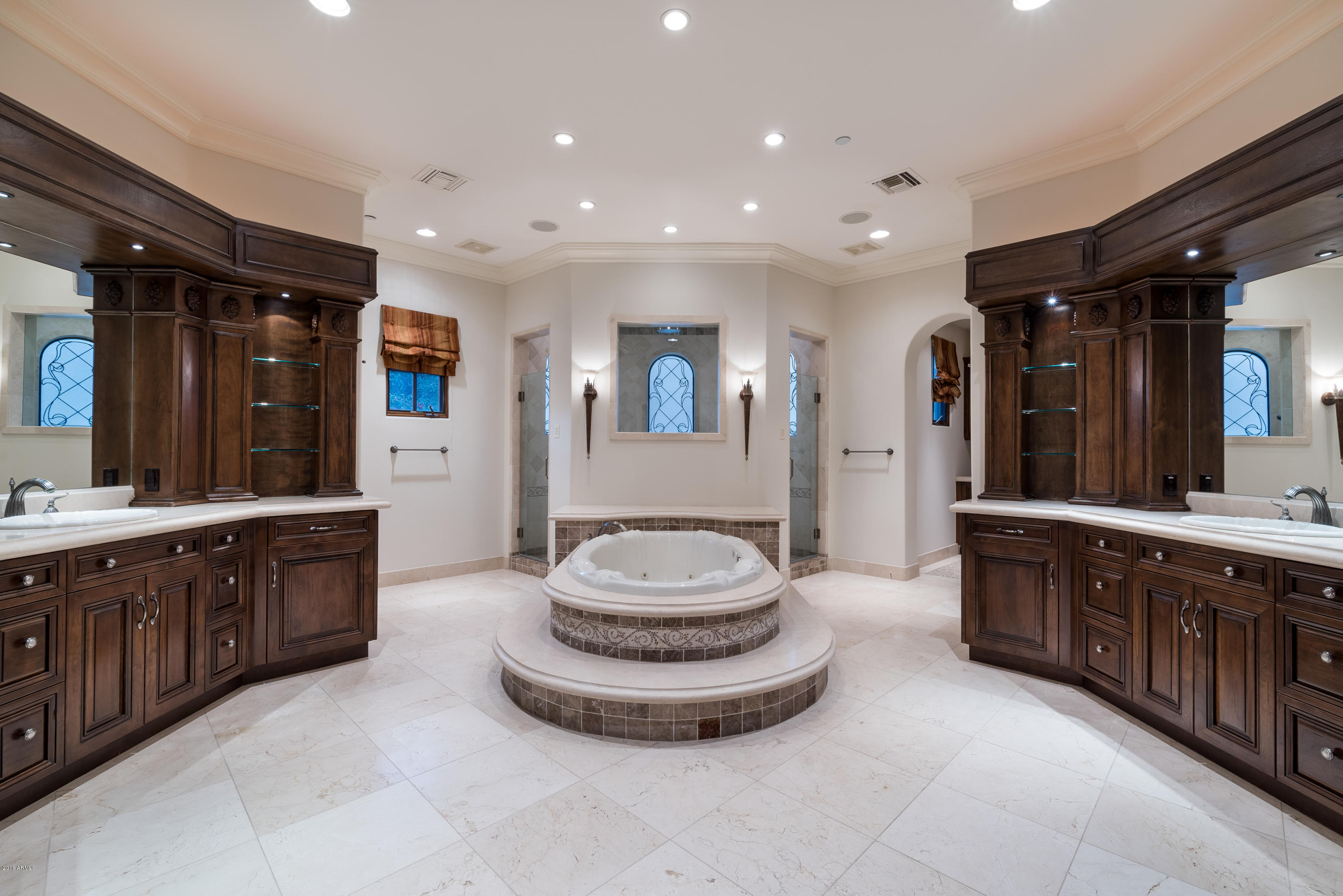 6390 East Royal Palm Road Paradise Valley, AZ 85253 - Photo 24 of 58 a spacious bathroom with a double vanity sink a large mirror and a bathtub