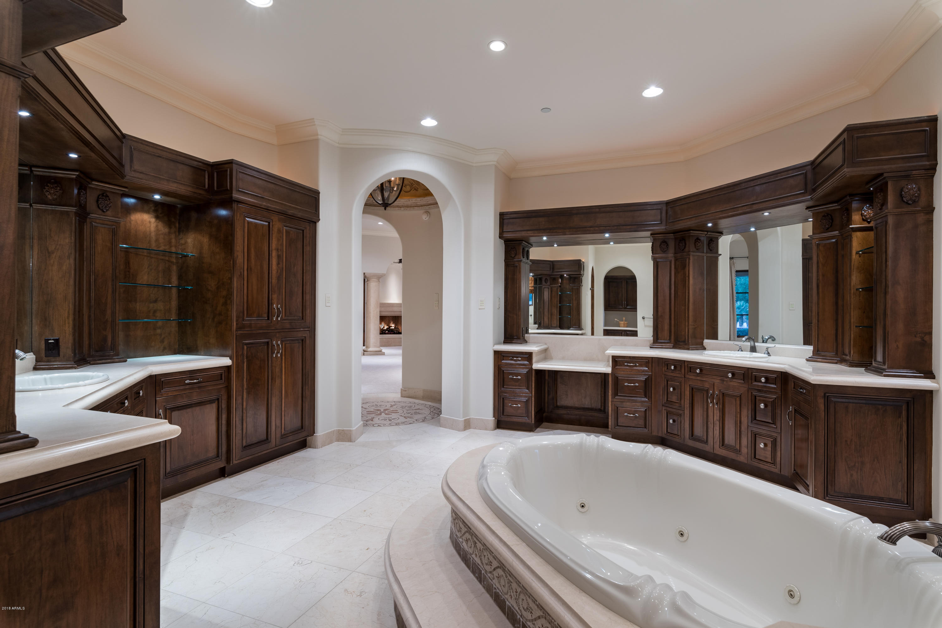6390 East Royal Palm Road Paradise Valley, AZ 85253 - Photo 25 of 58 a bathroom with a bathtub a double vanity sink and mirror