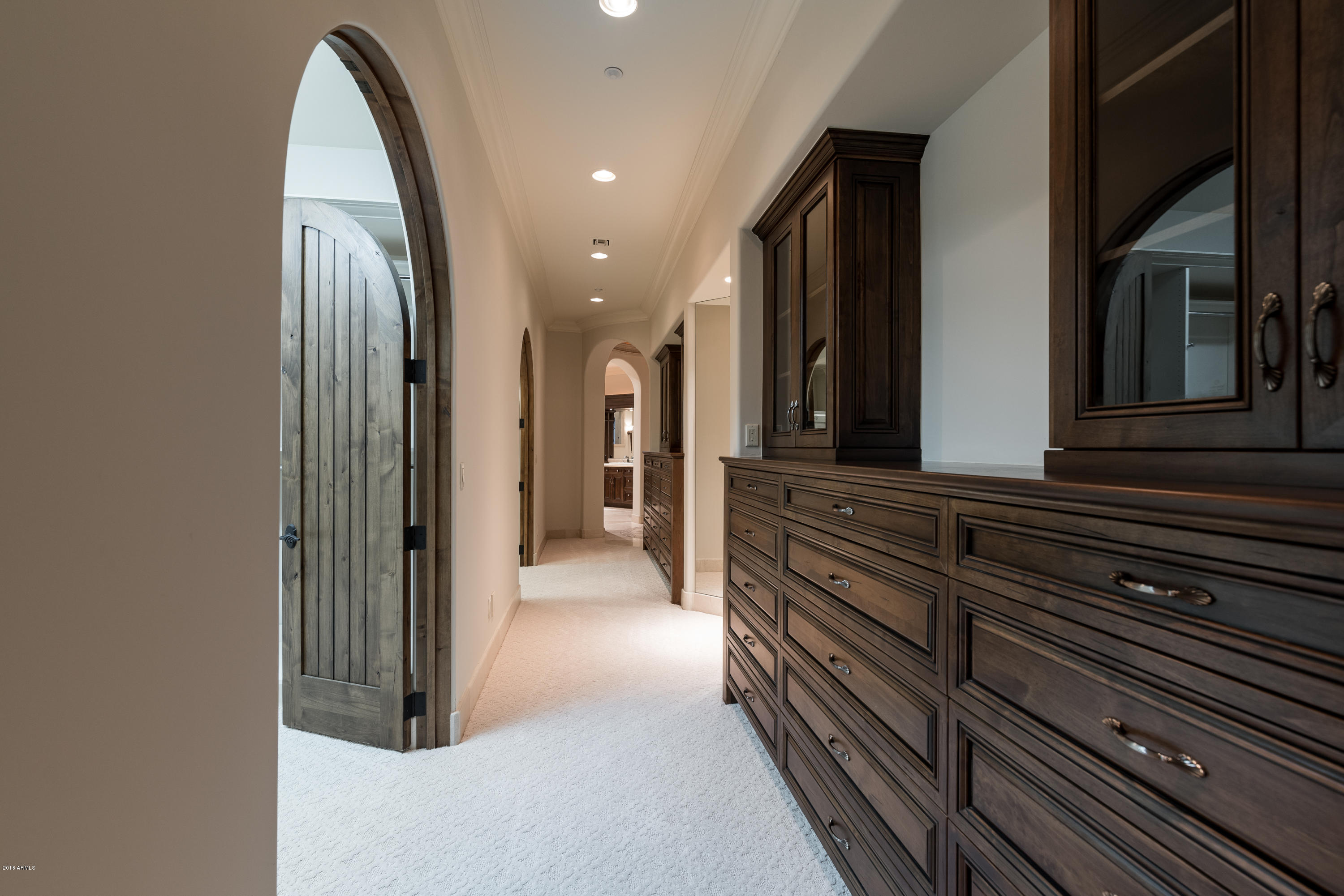 6390 East Royal Palm Road Paradise Valley, AZ 85253 - Photo 27 of 58 a view of a hallway with entryway wooden floor and windows