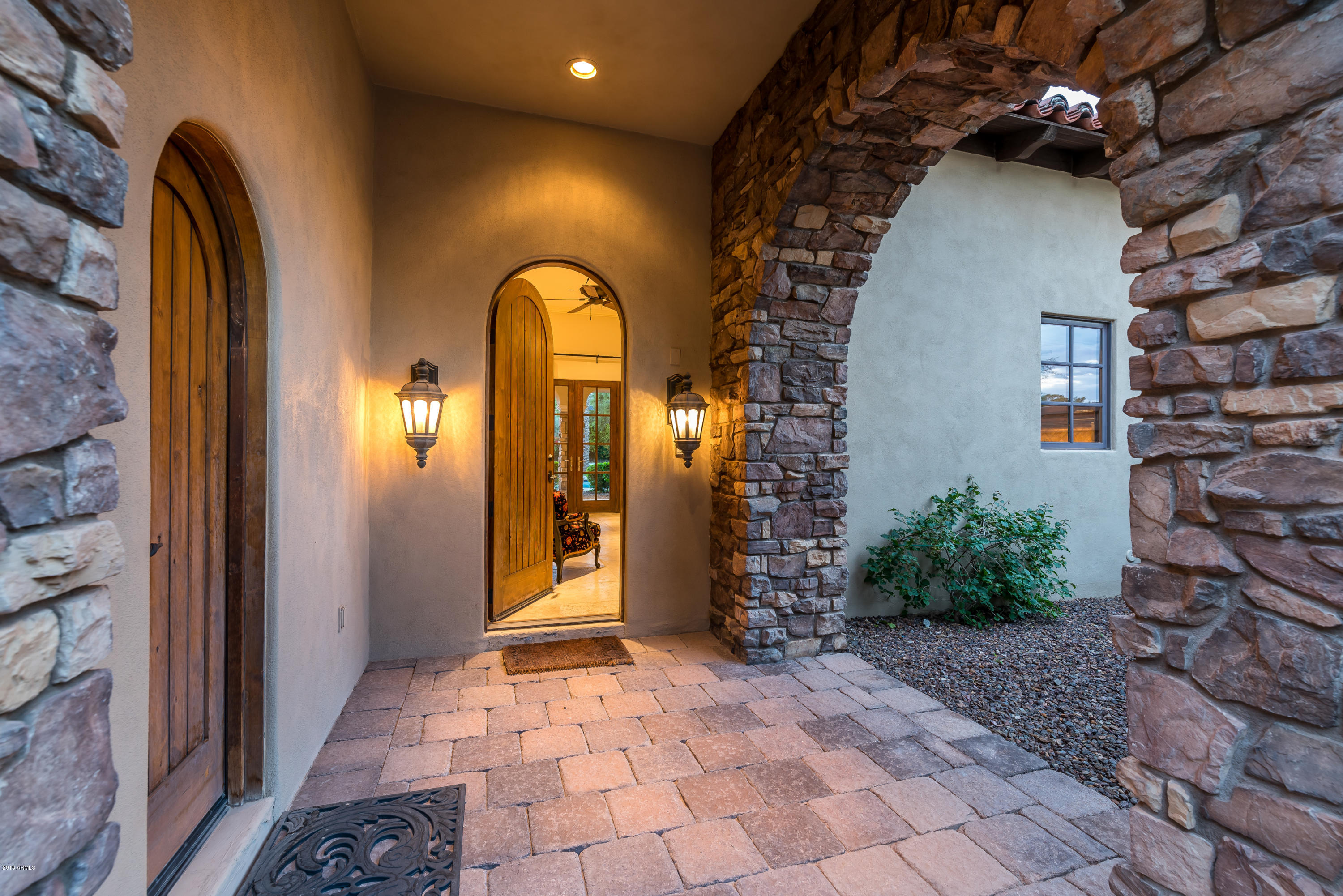 6390 East Royal Palm Road Paradise Valley, AZ 85253 - Photo 29 of 58 a view of entryway with a front door and wooden floor