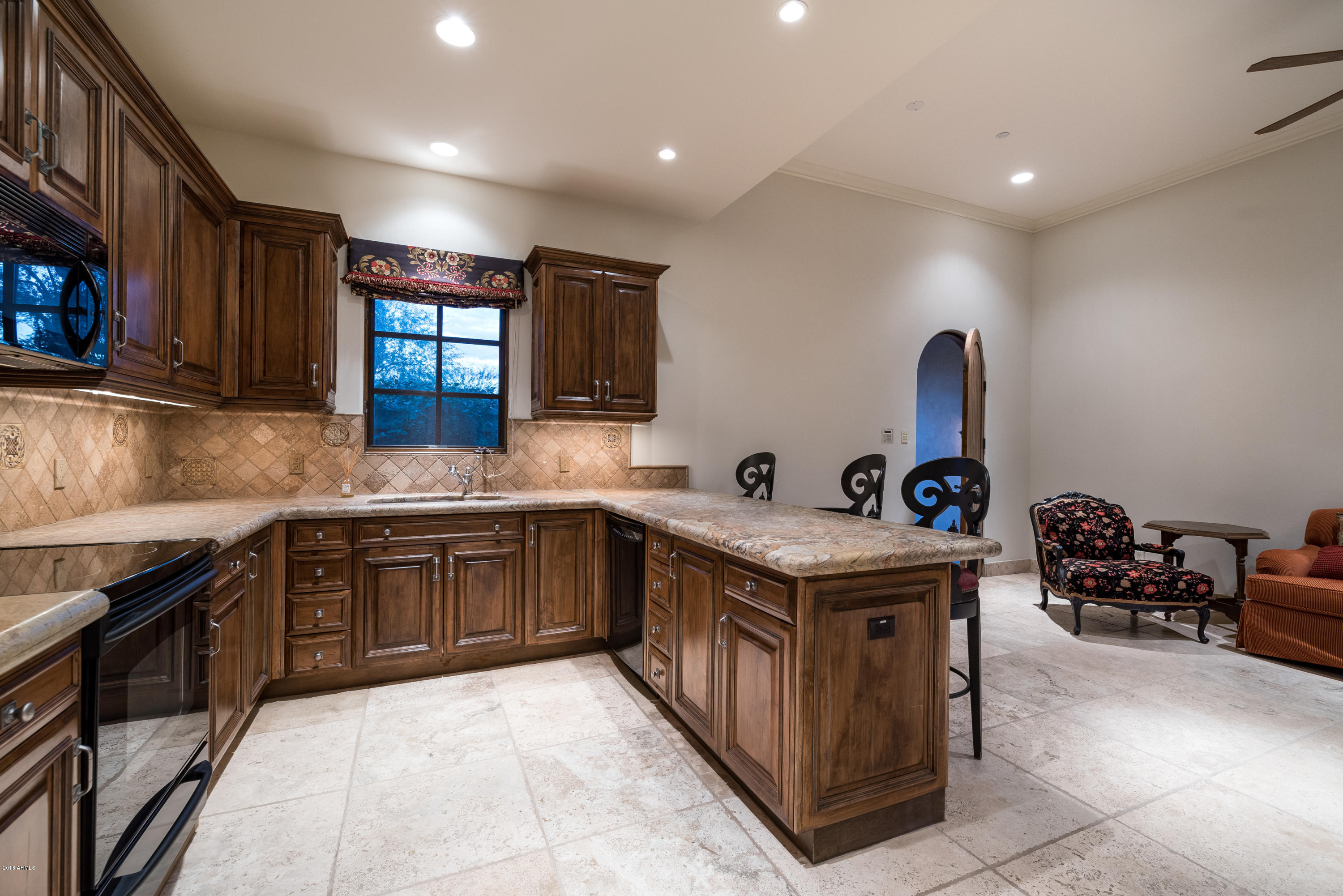 6390 East Royal Palm Road Paradise Valley, AZ 85253 - Photo 32 of 58 a kitchen with stainless steel appliances granite countertop a stove a sink and a microwave