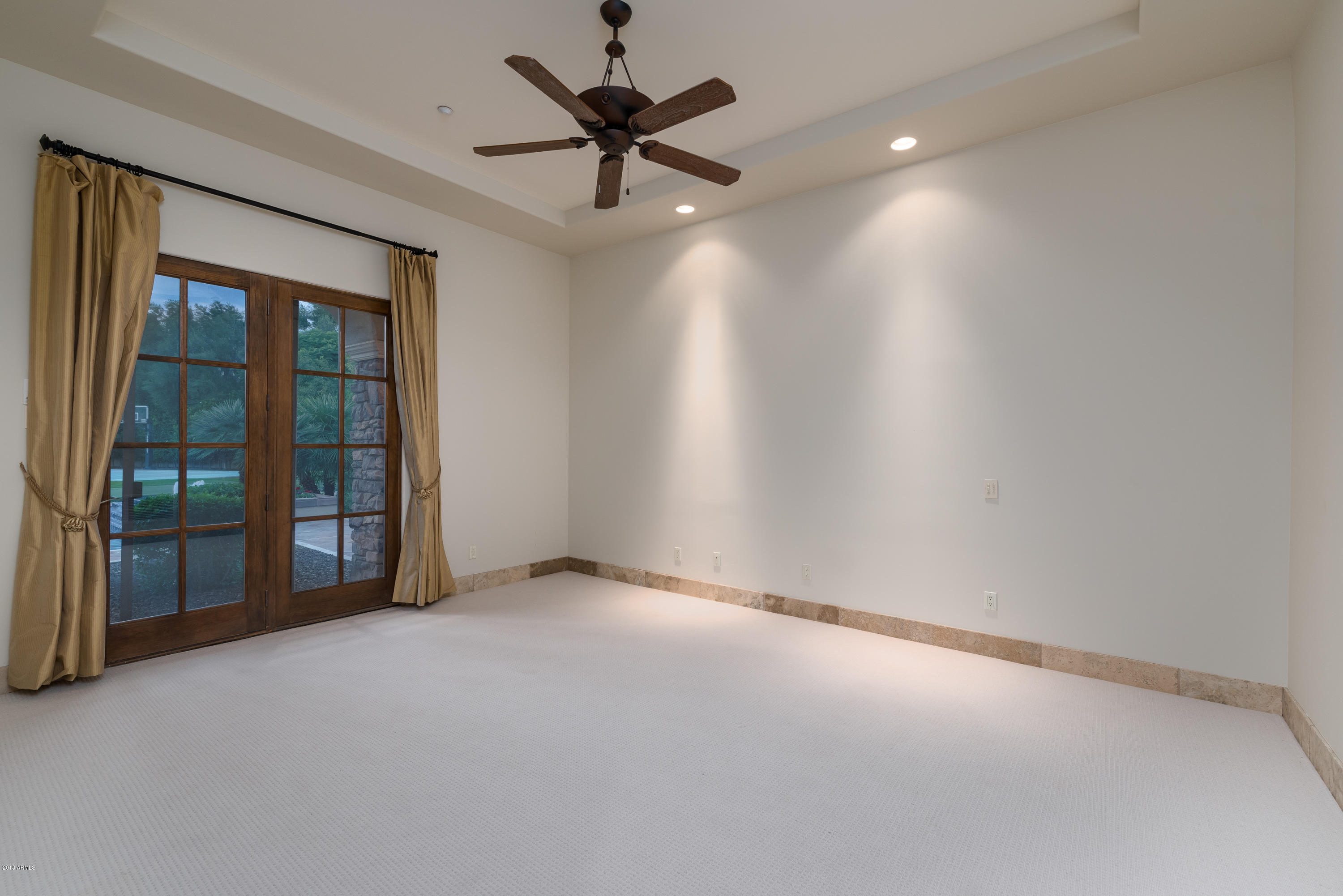 6390 East Royal Palm Road Paradise Valley, AZ 85253 - Photo 33 of 58 wooden floor in an empty room with a window