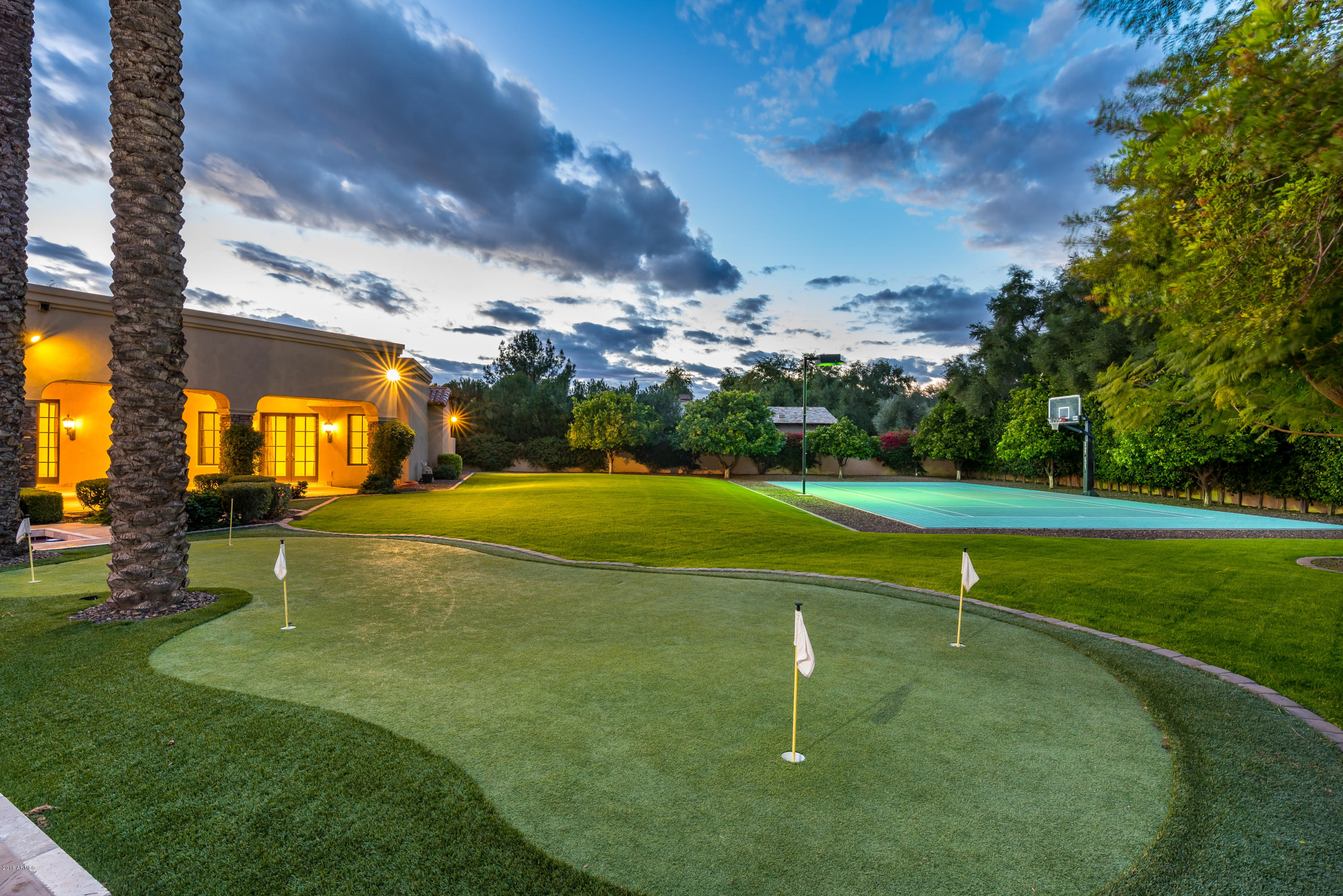 6390 East Royal Palm Road Paradise Valley, AZ 85253 - Photo 6 of 58 a swimming pool with outdoor seating and yard