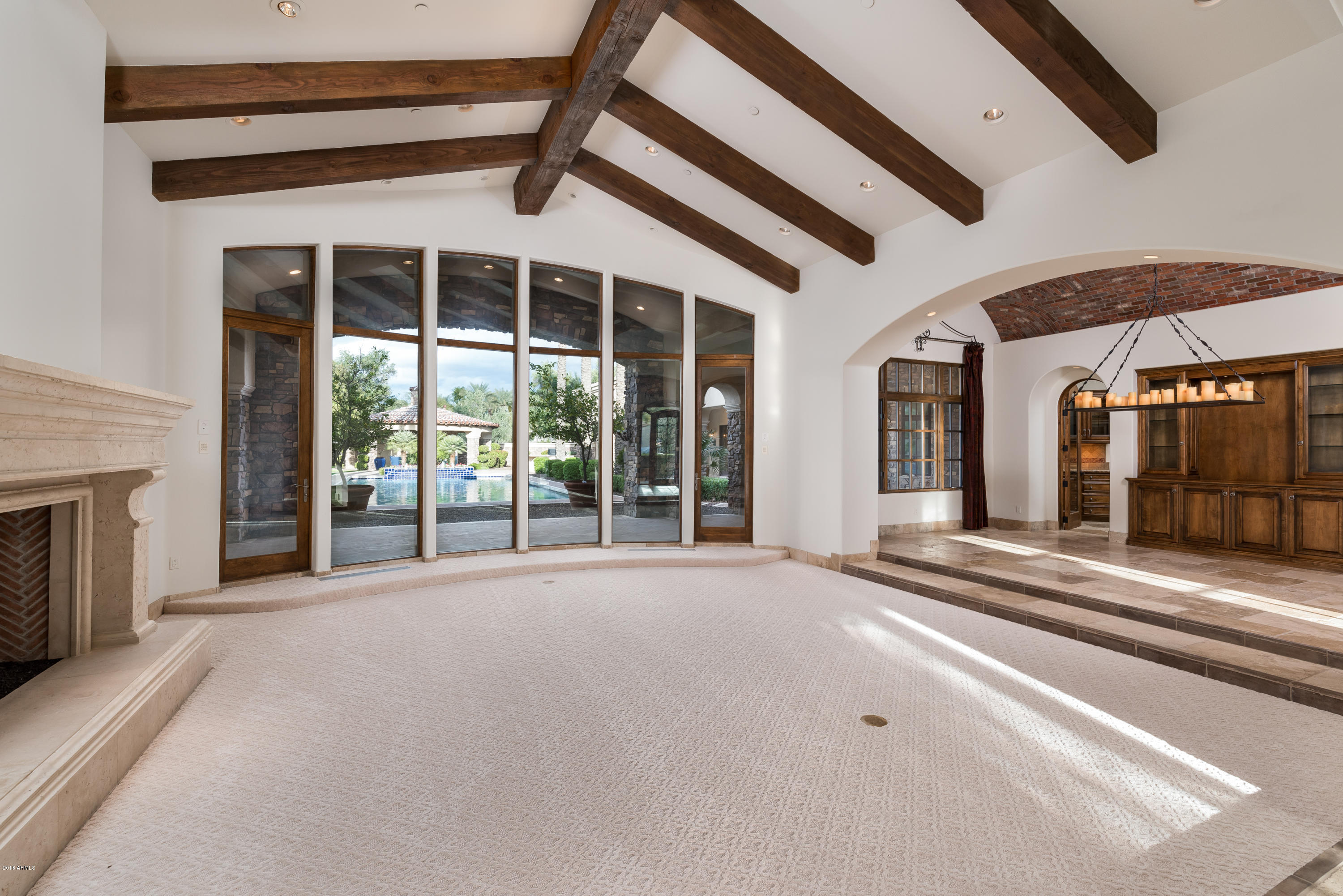 6390 East Royal Palm Road Paradise Valley, AZ 85253 - Photo 8 of 58 a view of a building with a large window and tv