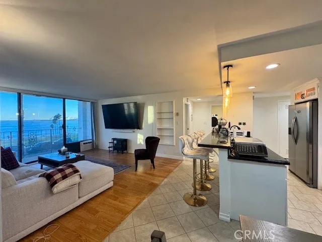 a living room with fireplace furniture and a flat screen tv