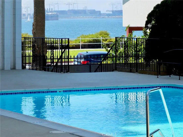 a view of swimming pool with outdoor seating