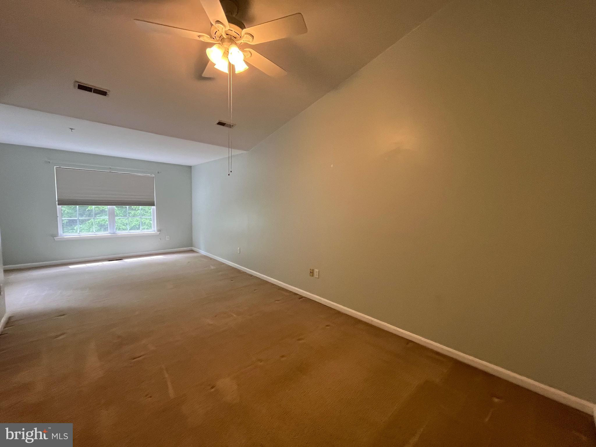 704 Shallow Ridge Court Abingdon, MD 21009 - Photo 18 of 41 an empty room with a fan & a window