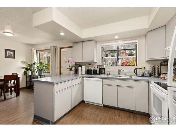 a kitchen with sink and cabinets