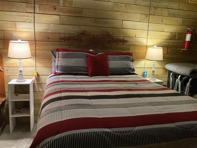 a bedroom with a bed and dresser