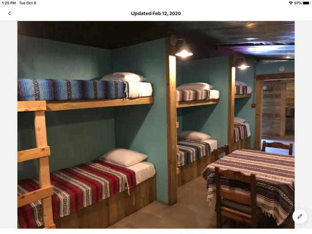 a bedroom with a bed and a mirror