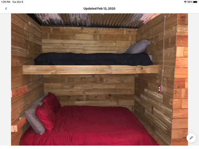 a view of a porch with furniture and a garage