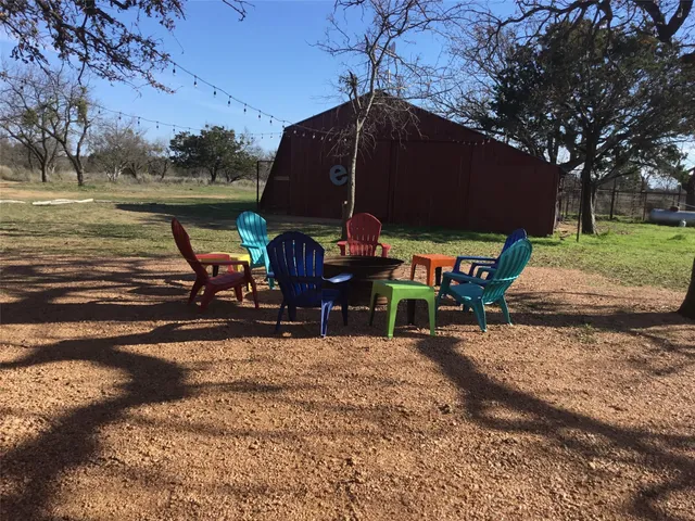 a view of a park with large trees