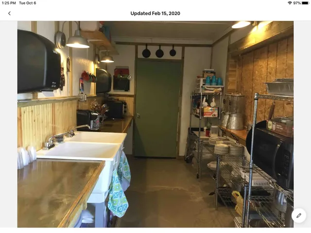 a room with gym equipment and a flat screen tv