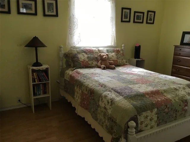 a bedroom with a bed and a table in it