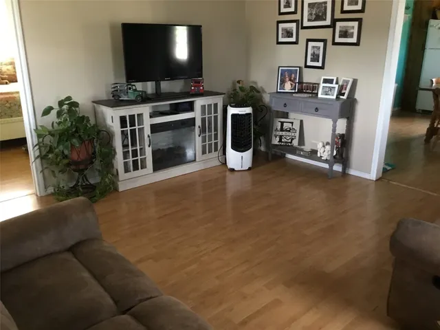 a kitchen with a table and a refrigerator