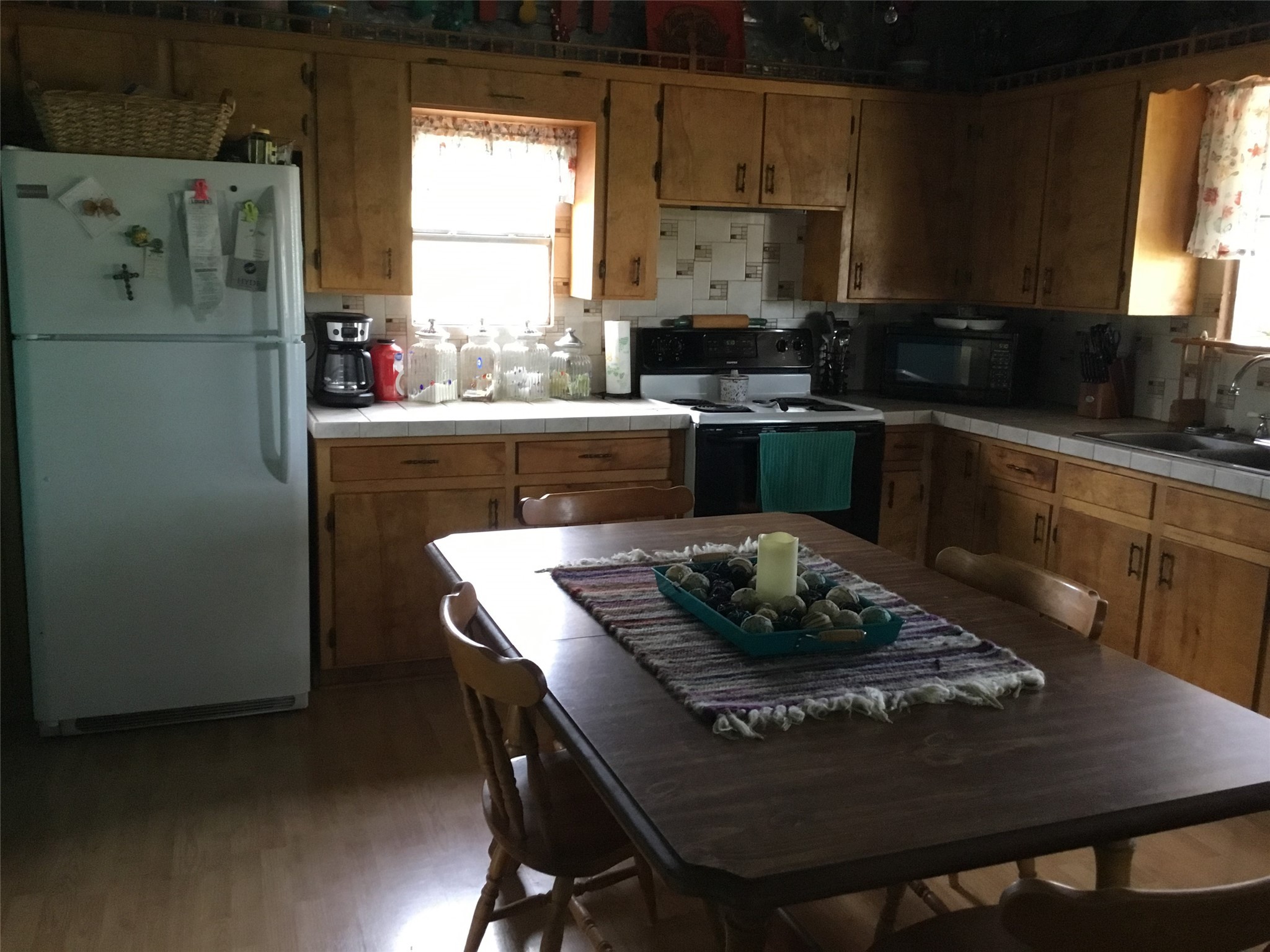 629 Elliott Road London, TX 76854 - Photo 42 of 49 a kitchen with a table and a refrigerator
