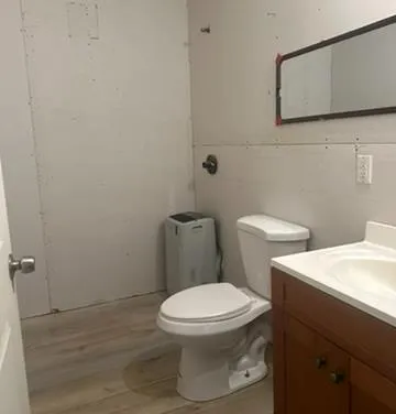 a view of a yard with basketball court