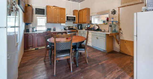 a white toilet sitting next to a bathroom sink