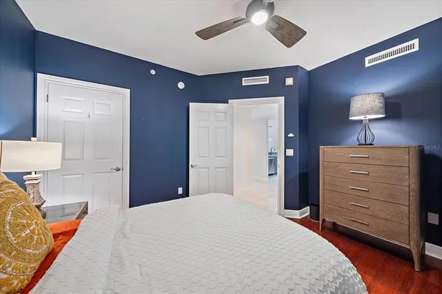 a bedroom with a bed and a dresser