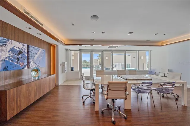 a view of a dining room with furniture window and wooden floor