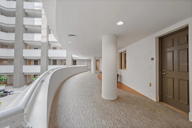 a large kitchen with cabinets and stainless steel appliances
