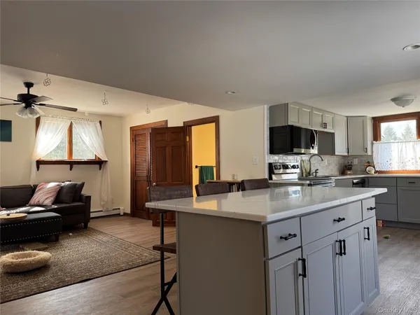 a kitchen with a stove a sink and a refrigerator