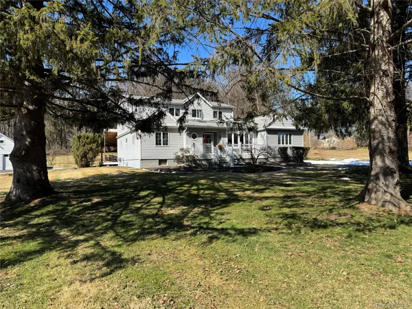 a large tree in front of a house