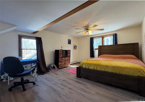 a bedroom with a bed and a chair