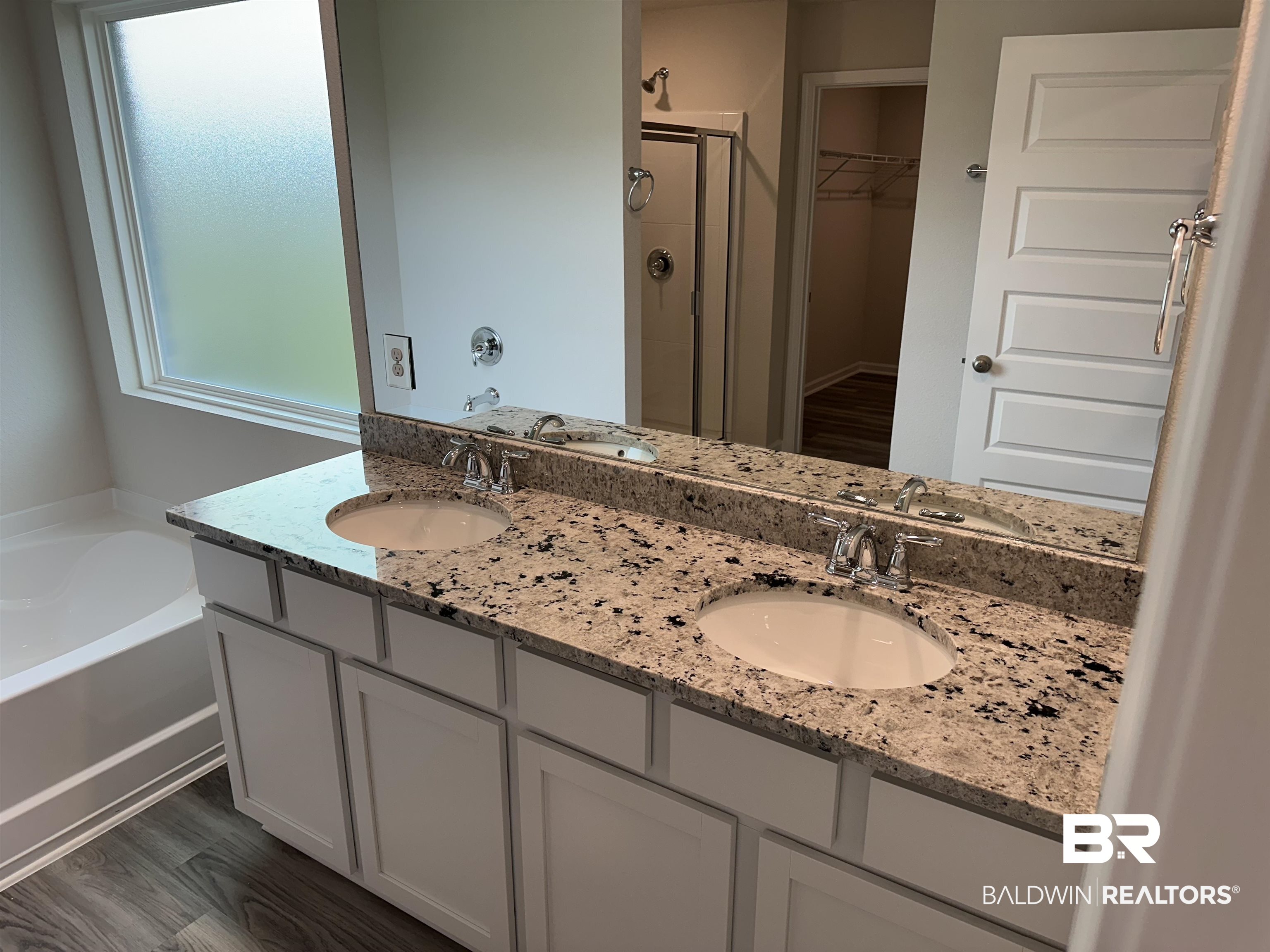 1238 Hayward Loop Foley, AL 36535 - Photo 31 of 46 Bathroom featuring separate shower and tub, vanity, and hardwood / wood-style flooring