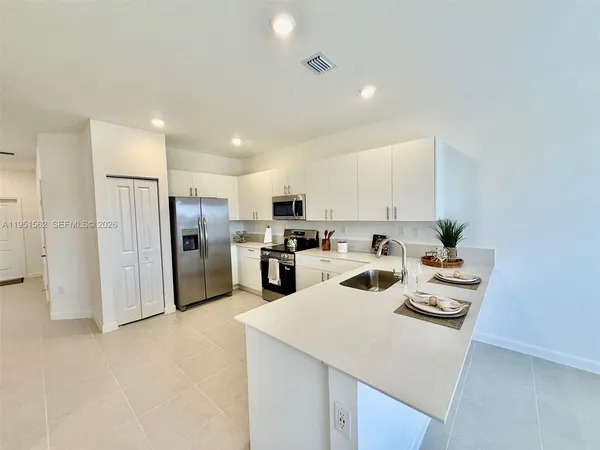 a view of kitchen and kitchen island