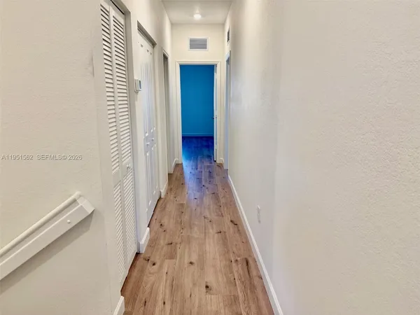 a view of a balcony with two chairs