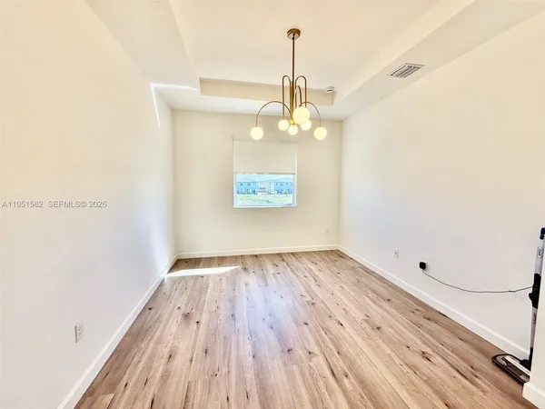 a view of an empty room and window