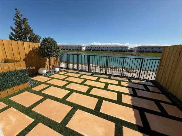 a view of swimming pool with patio