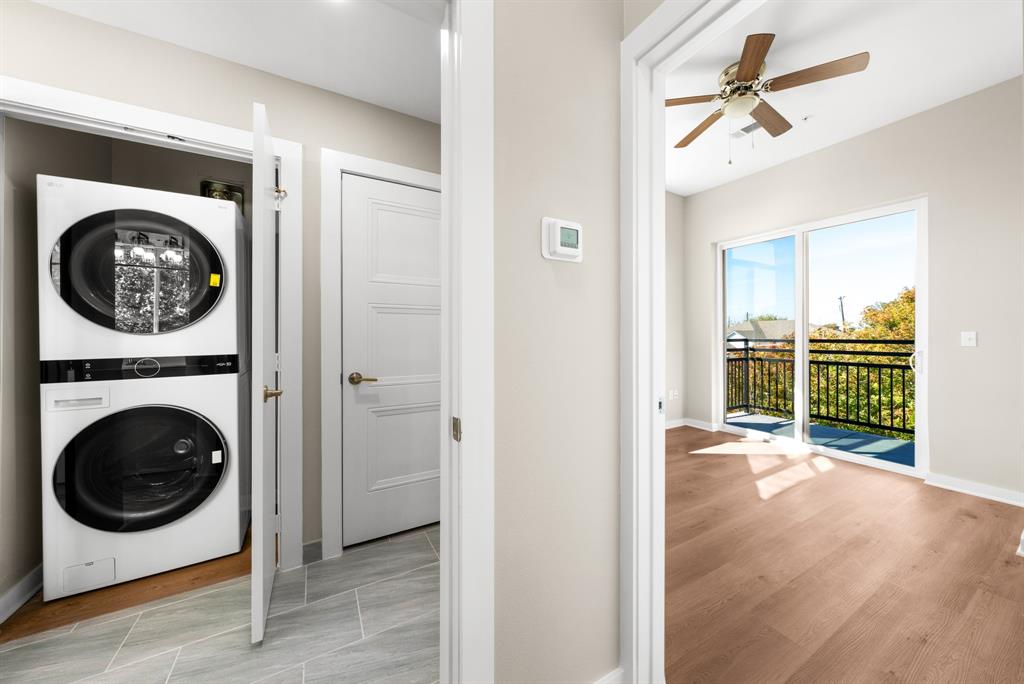 3522 Main Street, Unit 212 Rowlett, TX 75088 - Photo 9 of 25 a view of a hallway with a washer and dryer