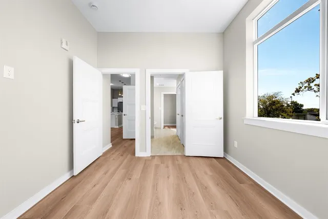 a view of a hallway with a washer and dryer