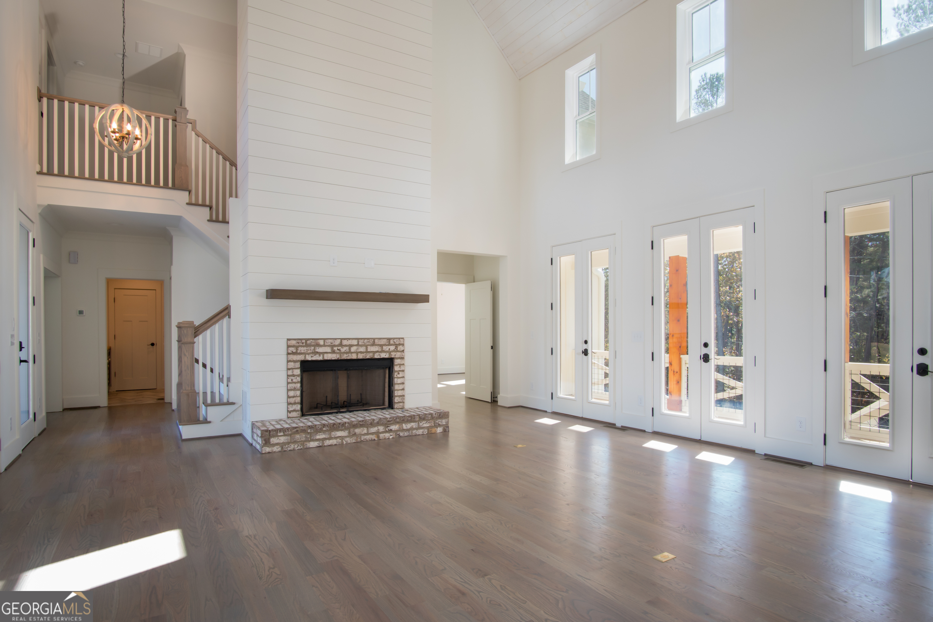 Lot 1 Cox Road Roswell, GA 30188 - Photo 28 of 38 a view of a big room with wooden floor fire place and windows
