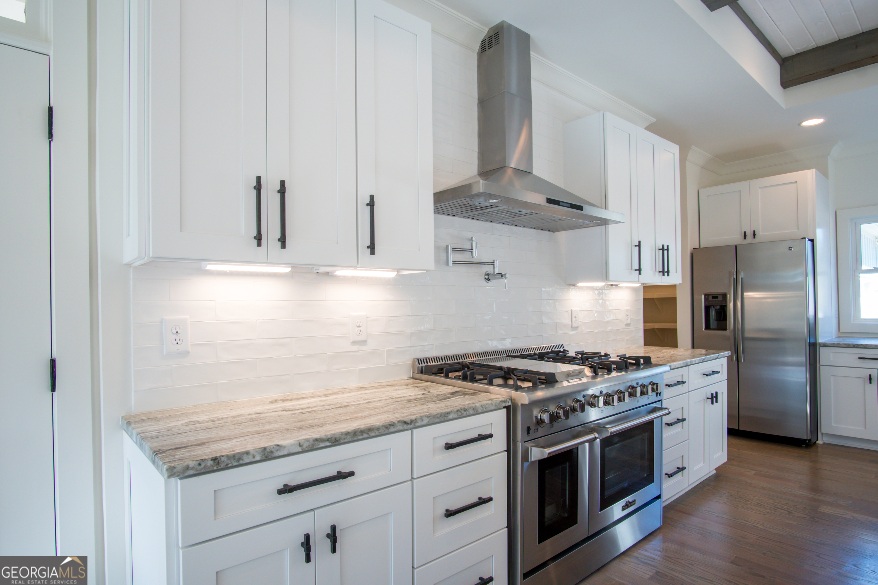 Lot 1 Cox Road Roswell, GA 30188 - Photo 30 of 38 a kitchen with stainless steel appliances granite countertop a stove a refrigerator and a granite counter tops
