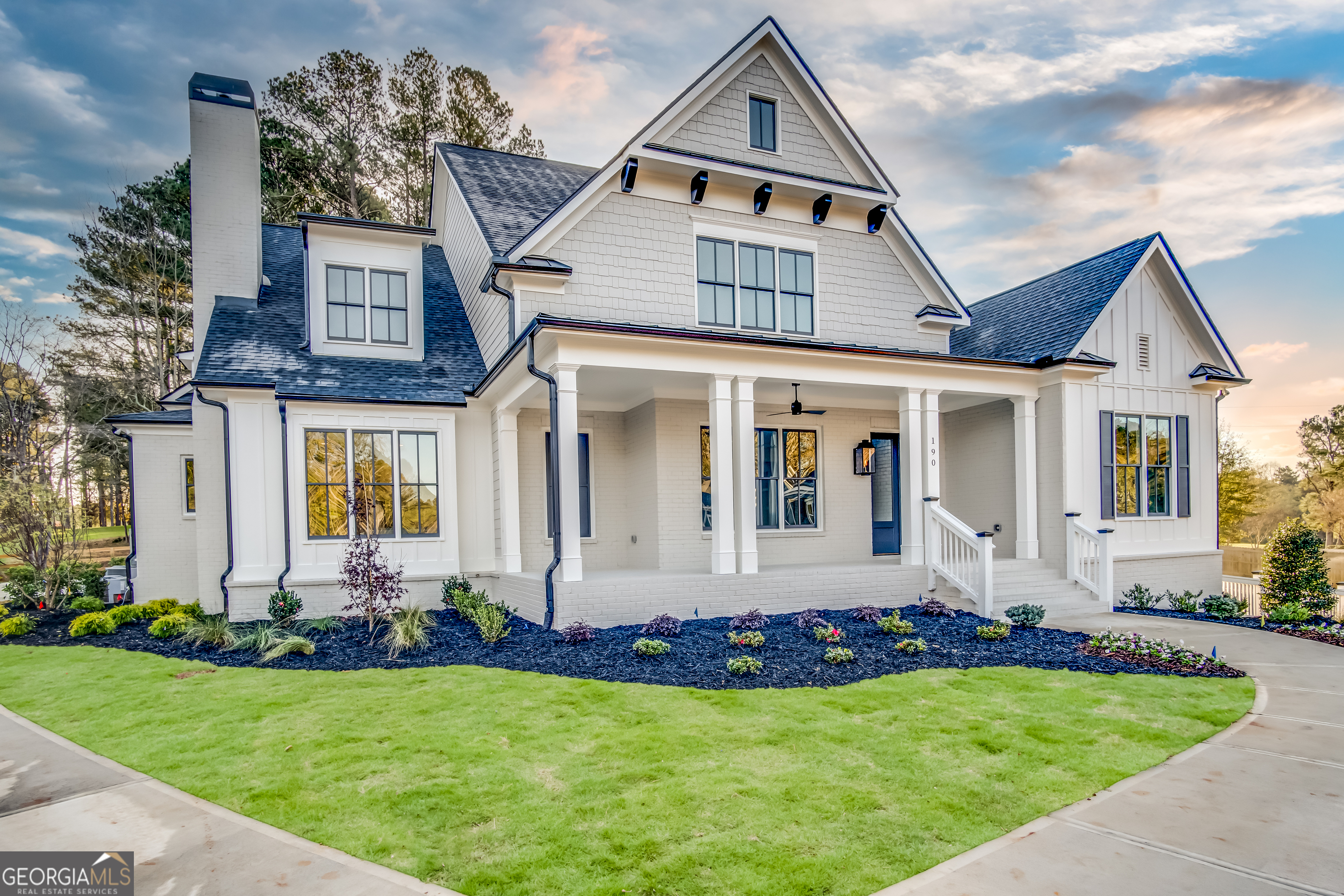 Lot 1 Cox Road Roswell, GA 30188 - Photo 3 of 38 a front view of a house with a garden and porch