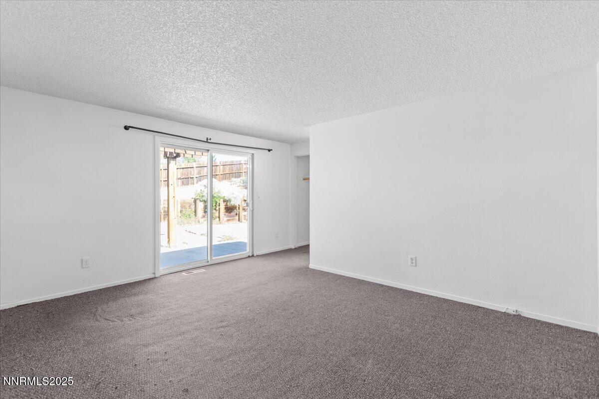 1090 Hartford Court Reno, NV 89503 - Photo 16 of 45 an empty room with windows