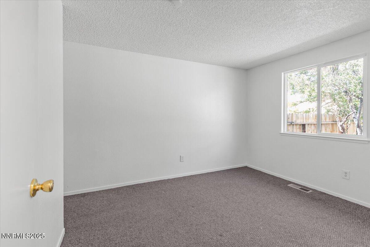 1090 Hartford Court Reno, NV 89503 - Photo 20 of 45 an empty room with a window