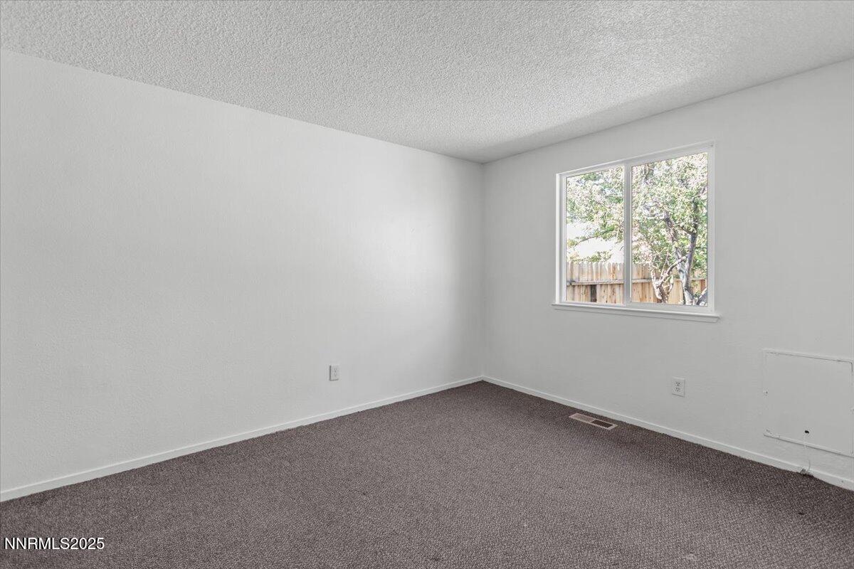 1090 Hartford Court Reno, NV 89503 - Photo 21 of 45 an empty room with a window