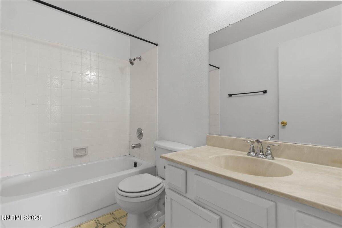 1090 Hartford Court Reno, NV 89503 - Photo 26 of 45 a bathroom with a sink a toilet and a bathtub