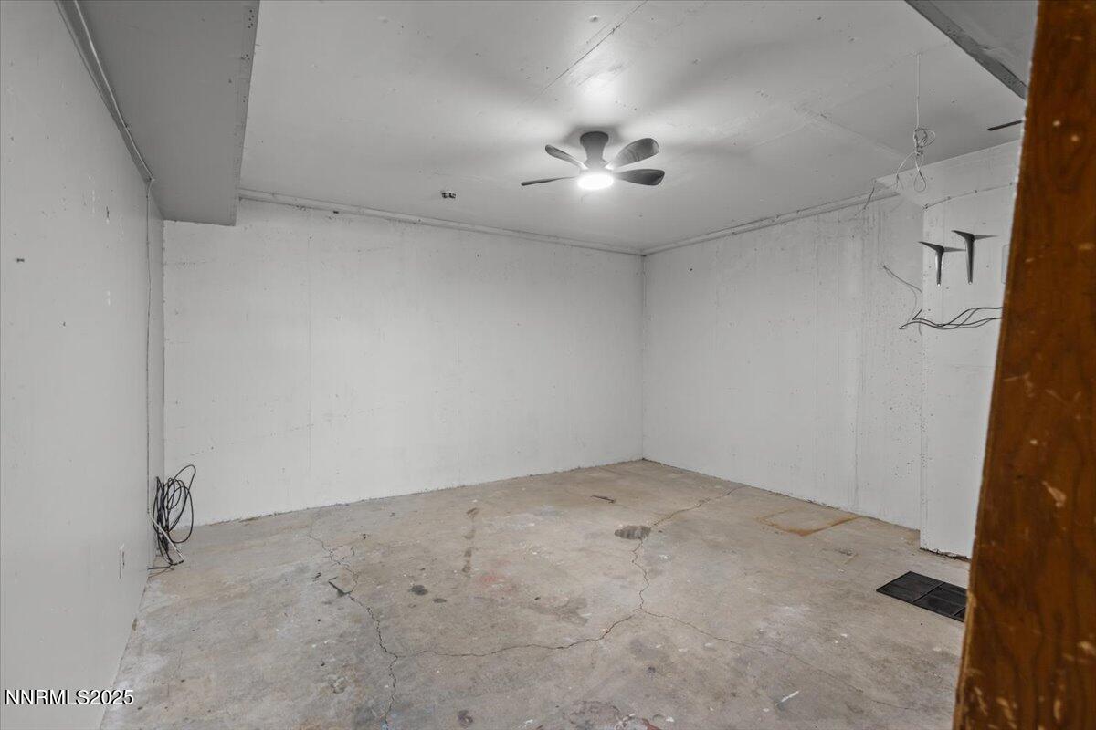 1090 Hartford Court Reno, NV 89503 - Photo 28 of 45 an empty room with a ceiling fan and carpet