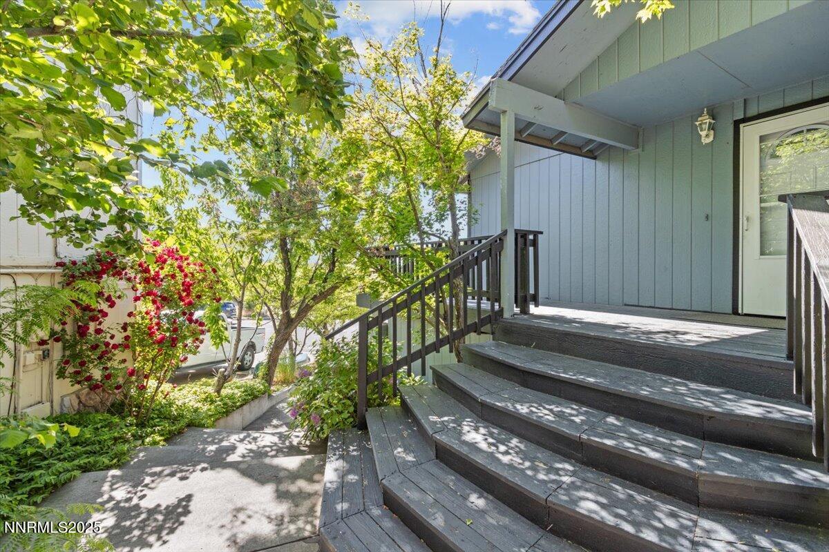1090 Hartford Court Reno, NV 89503 - Photo 5 of 45 a view of backyard with wooden fence and potted plants