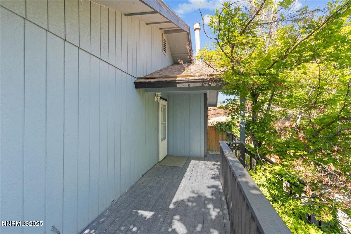 1090 Hartford Court Reno, NV 89503 - Photo 6 of 45 a view of a pathway of a house with potted plants