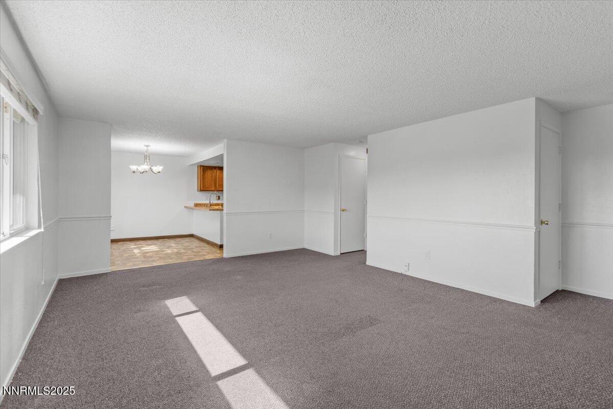 1090 Hartford Court Reno, NV 89503 - Photo 7 of 45 a view of an empty room with a window