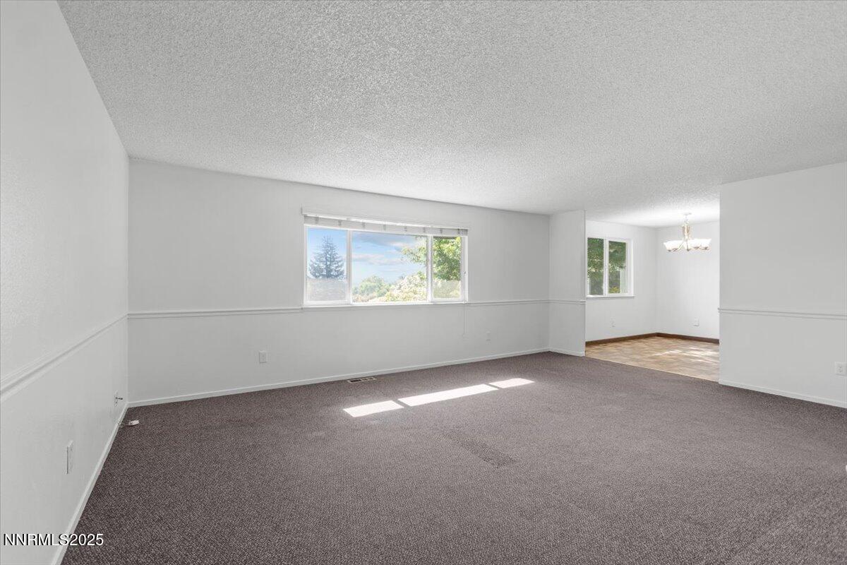 1090 Hartford Court Reno, NV 89503 - Photo 9 of 45 an empty room with windows