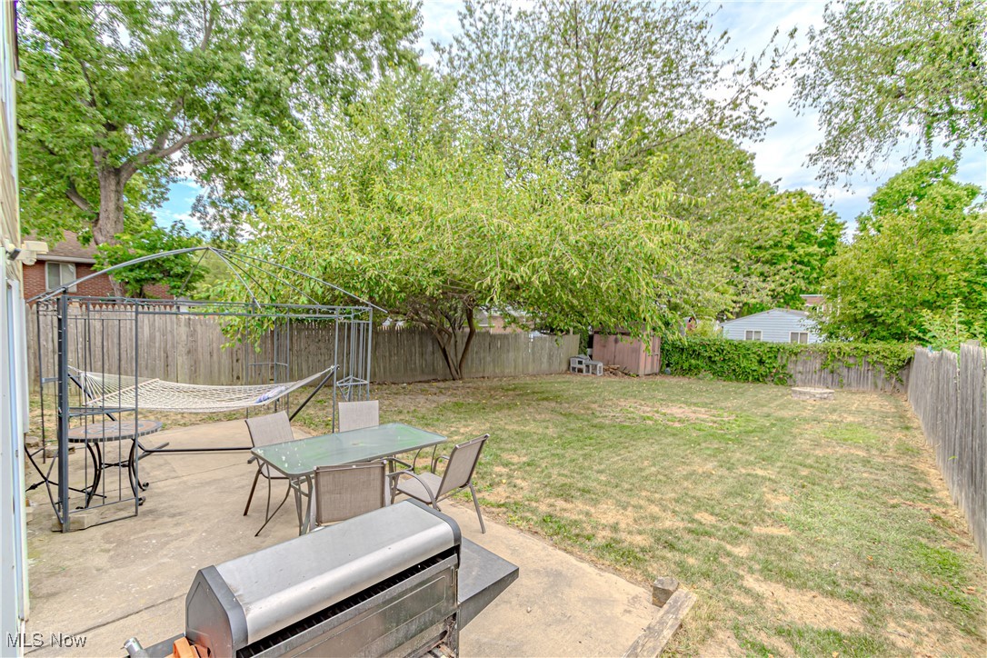 360 Baldwin Road Akron, OH 44312 - Photo 22 of 22 Fenced backyard featuring a patio area and outdoor dining area