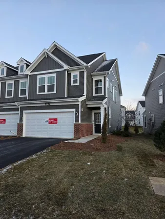 a view of a white house with large windows